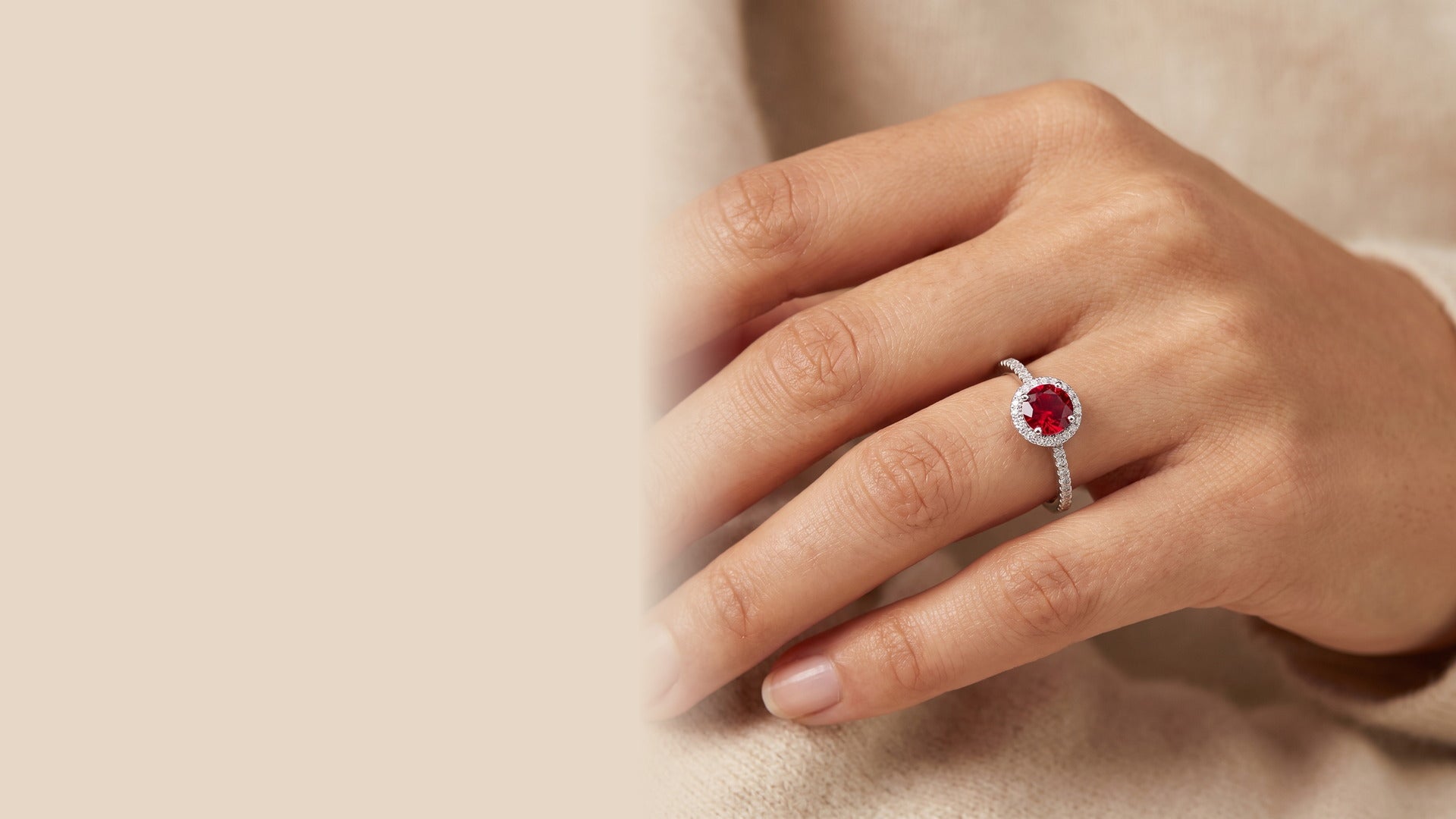 A model wearing an Ammirah Royale red gemstone ring